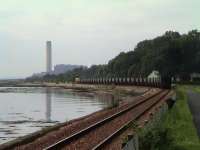 A Longannet bound coal train heads past Culross on a late summer evening in 2004.<br><br>[Colin McDonald 08/09/2004]