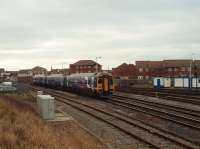 A York to Blackpool North service, formed by Northern 158754, is on the last few yards of its 3 hour journey. It is passing the entrance to Blackpool maintenance depot sidings, and Blackpool No.2 signal box, as it approaches the platforms that are just out of picture to the left. <br><br>[Mark Bartlett 27/11/2011]