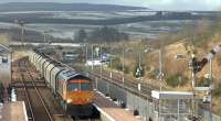 GB Railfreight no 66735 takes train 6H97, the diverted Hunterston HL to Drax power station, through New Cumnock on 18 February 2016.<br><br>[Ken Browne 18/02/2016]