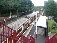 320317 calls at Garrowhill on the first day of autumn 2006 with a Balloch - Airdrie service. View west from the station footbridge towards Shettleston. <br><br>[John Furnevel 01/09/2006]