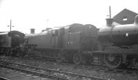 Locomotives awaiting disposal in the sidings at Eastfield in the autumn of 1963, including Stanier 3P 2-6-2T no 40186. Withdrawn from Motherwell at the end of 1962 it was eventually cut up at Cowlairs Works in December 1963.<br><br>[K A Gray //1963]