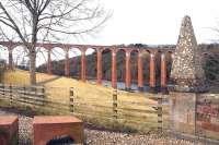 Looking west along the Tweed towards Leaderfoot Viaduct on 6 March 2016.  The large pyramidal finial marks the southern entrance to the category A listed Drygrange Old Bridge, dating from 1780, which carried the A68 across the Tweed until 1974. Some 300m behind the camera is the confluence of the rivers Tweed and Leader.<br><br>[John Furnevel 06/03/2016]