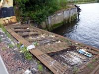 Still to be found on the south side of the River Clyde are the bearing pads for the Partick-Govan ferry's ramp. At its height this was a vehicular ferry steamer with an elevating platform, capable of being adjusted to suit the state of the tide, which could carry eight carts and a staggering three hundred passengers. Govan Cross Subway station and the Govan Branch's terminus were a short distance down Water Row from the ferry.<br><br>[Colin Miller 11/08/2014]