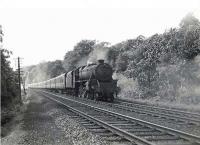 Corkerhill Black 5 45007 photographed near Bargany, Ayrshire, on the approach to Dailly on 15 August 1959 with a train from Girvan for Glasgow St Enoch. [Ref query 3415] <br><br>[G H Robin collection by courtesy of the Mitchell Library, Glasgow 15/08/1959]