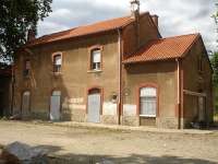 The frontage of the former Ceret station, in the Pyrénées-Orientales area of the Catalan region of south west France. The station stands on the abandoned section, beyond St-Jean-Pla-de-Cort, of the branch that leaves the coast line to Spain near Argeles sur Mer. Track is still in place through to just beyond the station, with an array of weed covered sidings opposite the building. <br><br>[David Pesterfield 29/07/2015]