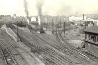 View over Buchanan Street station in the spring of 1957. Perth based Black 5 no 44704 is in the process of departing with the down <I>Granite City</I> for Aberdeen. [See image 23698]  <br><br>[G H Robin collection by courtesy of the Mitchell Library, Glasgow 27/05/1957]