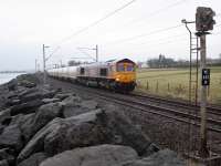 Round the rugged rocks the GB Railfreight ran.<br><br>
66736 with empties returning to North Blyth pass Cardross.<br><br>[Ewan Crawford 11/03/2016]