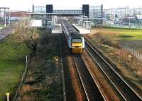 The GNER up <i>Highland Chieftain</i> runs east through Edinburgh Park station on a chilly December morning in 2004. The HST has run non-stop from Falkirk Grahamston and will soon begin to slow ready for its next scheduled stop at Haymarket.<br><br>[John Furnevel 08/12/2004]