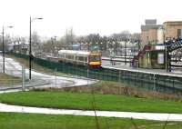 A recently arrived First ScotRail service from Glasgow Queen Street stands in the rain at Stirling's bay platform 10 on a wet Wednesday in January 2005 awaiting its departure time with the return service.<br><br>[John Furnevel 26/01/2005]