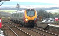 Virgin Voyager 221142 speeds through New Cumnock on 18 February 2016 with the shuttle from Glasgow Central to Carlisle. The service was put in place following the closure of Lamington Viaduct. Note the coal loading point on the right.<br><br>[Ken Browne 18/02/2016]