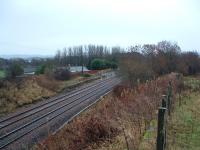 View towards Edinburgh at Broxburn Junction in 2003. The Broxburn branch ran off to the right and there were several sidings off the branch. The loading bank to the left was part of a small goods yard at the junction.<br><br>[Ewan Crawford 26/12/2003]