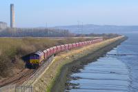 DBS 66037 skirts the Forth with empties with the doomed power station in the background.<br>
<br>
During the final three weeks of March trains may run daily, although timetabling is not be reliable.<br><br>[Bill Roberton 14/03/2016]
