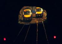 Seen from the end of platform 3 through the Cowlairs Tunnel  and at a distance of over 1km, two Class 170 DMUs pass in the sunlight on the final day before the tunnel closure for track upgrade work.<br><br>[Colin McDonald 19/03/2016]