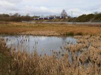 The 0944 from Glasgow Central to Inverness on the Whifflet line near Baillieston on the 21st March 2016. This service is one of those being diverted from Glasgow Queen Street High level due to the Cowlairs Tunnel works.<br><br>[Colin McDonald 21/03/2016]