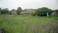 Part of the alignment to the north of Dalhouse of the Edinburgh and Dalkeith Railway viewed from the trackbed of the Edinburgh and Hawick line in 2002. The line was extended south by the Arniston Branch of the Marquis of Lothian's Waggonway to Newbyres Colliery down the east side of today's A7. The Edinburgh and Hawick took an entirely new alignment south over the Newbattle Viaduct to Arniston running to the west of the A7.<br><br>[Ewan Crawford //2002]