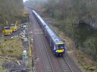 A little to the east of Philipstoun a Glasgow - Edinburgh service led by 170429 passes an access point for road-rail machinery.<br><br>[Bill Roberton 15/03/2016]