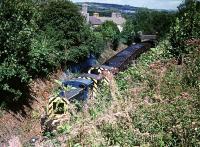 Three 03s come south from Cwm Mawr through Pontyberem, passing under the B4306.<br><br>[Andrew Saunders //1982]