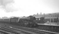 The 12.58pm ex-Grantham arrives at a wet Doncaster station on 6 July 1963 behind A3 Pacific 60107 <I>Royal Lancer</I>.<br><br>[K A Gray 06/07/1963]