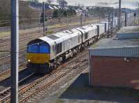 DRS 66429 and friend power the Daventry - Mossend Tesco train past Lockerbie loops on 16 March.<br><br>[Bill Roberton 16/03/2016]