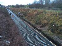 A class 66 hauled works train slowly creeps up the newly laid track on the Cowlairs Incline.<br><br>[Martin MacGuire 30/03/2016]