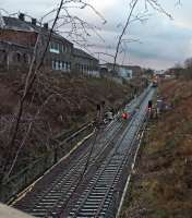 Evening shift clipping new rails onto sleepers set at new lower level to accommodate OHLE.<br><br>[Martin MacGuire 30/03/2016]