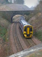 158735 coasts downhill into Aberdour on 17 March.  In the background is evidence of vegetation clearance and stabilising work.<br><br>[Bill Roberton 17/03/2016]