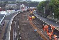 Track replacement work within the station limits at Cupar on 31 January 2016. View north towards Leuchars. The tail of the engineers train can be seen in the background, with locomotive 66005 out of sight around the curve.<br><br>[Andrew Wilson 31/01/2016]