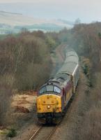 37 427 nears Fort William with the sleeper from London Euston in April 2003.  Seen from the Aonach Mor access road.<br><br>[Bill Roberton /04/2003]