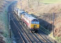 The Crewe-Sellafield flasks were around 50 minutes late as they passed through the cutting at Forton on 17th March 2016. The train was headed by <I>Pullman</I> liveried DRS 57305 <I>Northern Princess</I>, probably a late substitute for a failed Class 37. DRS 37602 is the second locomotive on the two wagon train. <br><br>[Mark Bartlett 17/03/2016]