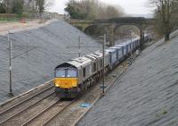Several cuttings to the south of Lancaster have had drains installed recently along with re-profiling to prevent landslips. 66429 and 66425 are seen approaching Hampson Lane near Galgate with the <I>Tesco Express</I> on 4th April 2016. <br><br>[Mark Bartlett 04/04/2016]