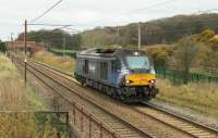 Scotrail liveried DRS 68006 <I>Daring</I> is a long way from the <I>Fife Circle</I> as it heads south at Woodacre working light engine from Kingmoor to Crewe Gresty Bridge on 22nd March 2016.<br><br>[Mark Bartlett 22/03/2016]