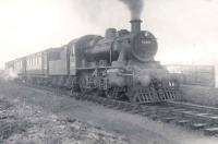 Ivatt 2-6-0 no 46460 with a St Combs branch train at Cairnbulg on 3 January 1953.<br><br>[G H Robin collection by courtesy of the Mitchell Library, Glasgow 03/01/1953]