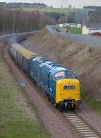 D9009 passes the former Kilnknowe Junction with a Derby - Tweedbank charter on 9 April. 67015 brings up the rear.<br><br>[Bill Roberton 09/04/2016]