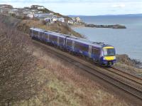 170425 passes Pettycur Bay with an Inverness - Edinburgh service.  In the background is Pettycur Harbour, which was used to deliver materials for construction of the Edinburgh and Northern  Railway.  The branch line created would later serve a coke works and bottleworks.  Sand was extracted from the beach below and drawn up an inclined tramway by a stationary engine on the headland now occupied by a caravan site, to the rear of the train. See the OS 25' map of 1914.<br><br>[Bill Roberton 28/03/2016]