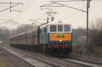 86259 <I>Les Ross</I> powers through the rain at Woodacre with a <I>Cumbrian Mountain Express</I> from Euston to Carlisle on 2nd April 2016. The train was handed over to 46233 <I>Duchess of Sutherland</I> at Carnforth for the journey over Shap and the electric ran light to Crewe to await the return service.<br><br>[Mark Bartlett 02/04/2016]