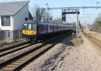 Northern Electric 319363 leaves Huyton heading for Lime Street on a service from Warrington Bank Quay. The next stop at Roby, a very short distance away, can also be seen. Huyton has changed significantly in just a few years with electrification and additional tracks. [See image 40738] for a similar view in 2012. <br><br>[Mark Bartlett 14/03/2016]