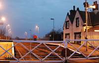 View south at Stallingborough from the level crossing in 2004. Since the photograph was taken the signal box (behind the camera) has closed and the gates have been removed. A new signal box, in traditional style, has been built by the station to the left. [Ref query 3986]<br><br>[Ewan Crawford 01/12/2004]