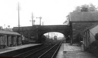 A photograph of Barton & Broughton station, possibly in LMS days, looking towards Preston. The bracket signals mark the start of the four track section to Preston. [See image 24648] for a view in the opposite direction from an earlier date when the main building had a bay window that was perhaps encroaching on the platform too much. [Ref query 6389] <br><br>[Mark Bartlett Collection //]