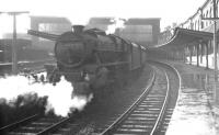 A wet summer evening at Carlisle in August 1965 as Black 5 no 44681 stands in south end bay platform 5 awaiting its departure time with the 7.45pm service to Carnforth.<br><br>[K A Gray 14/08/1965]