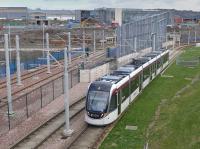 Tram 256 passes the Edinburgh Gateway construction site.<br><br>[Bill Roberton 06/04/2016]