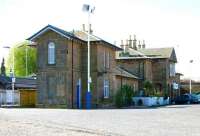 The imposing 1847 main station building at Cupar, photographed looking south in May 2005. The original E&NR plan was to install a level crossing here, but, thanks to the efforts of local churchman and politician David Crichton, a bridge was provided. The benefits of the bridge are particularly obvious today, not least in providing an appropriate location for the statue of the said gentleman, which can be seen on the extreme left of the picture.  <br><br>[John Furnevel 22/05/2005]