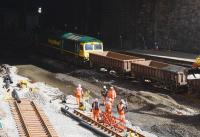 Freightliner 66595 slowly propels wagons for uplifting spoil on an engineering train on the morning of 16th April 2016.<br><br>[Colin McDonald 16/04/2016]