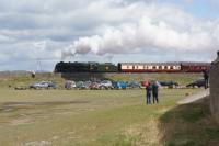 Creating it's own shadow as it restarts from a signal check at Arnside, 46100 Royal Scot travels along the embankment towards the viaduct over the River Kent with a tour to Carlisle via the coast.<br><br>[John McIntyre 16/04/2016]