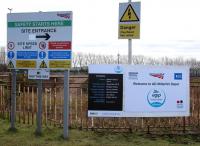 New signage at the entrance to Millerhiil yard from Whitehill Road on 17 April 2016. Road access to the planned new EMU servicing depot is in the left background (indicated by the 'HGV this way' sign).<br><br>[John Furnevel 17/04/2016]