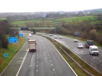 A long steel bridge, that previously carried coal trains on the Worsborough to Silkstone section of the Manchester to Wath 1500V Woodhead route, crossing the M1 motorway near Gilroyd south of Dodworth. The trackbed from Silkstone to Wombwell is now known as the Dove Valley Trail, and forms a part of the longer distance Trans Pennine Trail. View south from Keresforth Road in April 2016<br>
 <br><br>[David Pesterfield 07/04/2016]