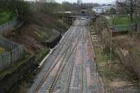 View down the Incline from Keppochhill Road. Rail mounted cement mixers and Road/Rail Vehicles can be seen parked at the Keppochhill Drive/Fountainwells access point. The north portal of the tunnel can be seen in the centre distance above the blue Fountainwells overbridge which is scheduled for demolition soon.<br><br>[Colin McDonald 15/04/2016]