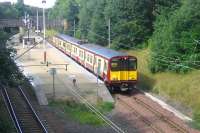 Just a mile and a half from its destination at Glasgow Central, 314201 pulls away from Pollokshields West on a warm and sunny Friday morning in August 2006 with a Cathcart Circle commuter service.<br><br>[John Furnevel 11/08/2006]