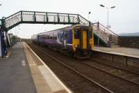 With the Duddon estuary over the platform wall to the right, a Barrow to Carlisle service arrives at Kirkby-in-Furness on 11 March 2016. After departing the train travelled in a long left hand sweep around the estuary eventually arriving at Green Road some 4 Kms away as the crow flies but over 6 1/2 Kms away by train with Foxfield station in between.<br><br>[John McIntyre 11/03/2016]