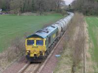 Freightliner 66512 nears Kincardine with thirty PCAs of fly ash from Aberthaw Power Station in South Wales to the breeze-block plant at Longannet, whose local supply has dried up...  The first of what should be a weekly train.  The previous flow was in the opposite direction, to Westbury Cement Works in the 1990s I think.<br><br>[Bill Roberton 11/04/2016]