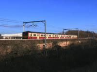 A class 318 EMU crosses the viaduct on the second day of the new timetable introduced on the newly electrified Whifflet line in December 2014.<br><br>[Colin McDonald 15/12/2014]